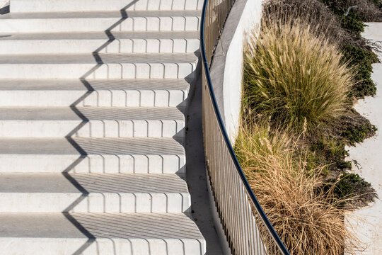 stairs concrete curve shadow pattern geometry minimal architecture abstract texture with strong contrast and clean lines for modern design background