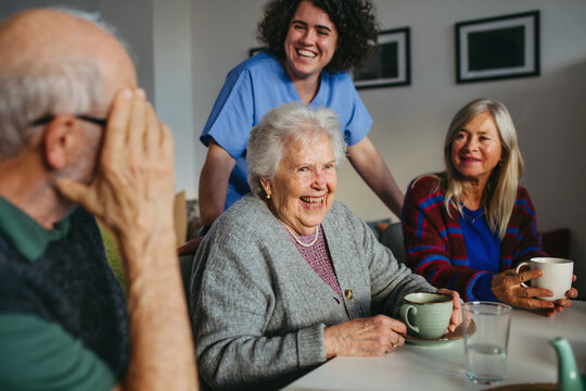Old people having good time together in community center.