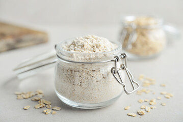 Oat flour in glass jar