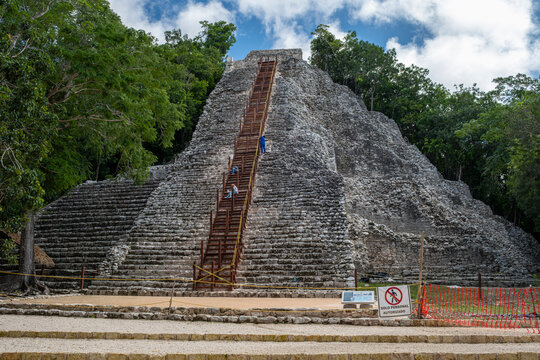 Nohoch Mul - main pyramid at Coba ruins archaeological site is under construction and no visitors allowed, sunny day, blue sky.  Yucatan Peninsula, Quintana Roo, Mexico.