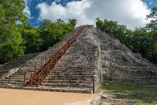 Nohoch Mul - main pyramid at Coba ruins archaeological site is under construction and no visitors allowed, sunny day, blue sky.  Yucatan Peninsula, Quintana Roo, Mexico.
