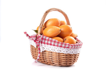 Fresh Oranges in Wicker Basket with Gingham Cloth