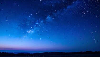 Fototapeta premium Vast Starry Night Sky with Milky Way Galaxy Over Horizon.