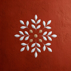 Rangoli pattern on a red surface, a traditional art celebrating Gudi Padwa. Indian festival and new year concept for creative design.