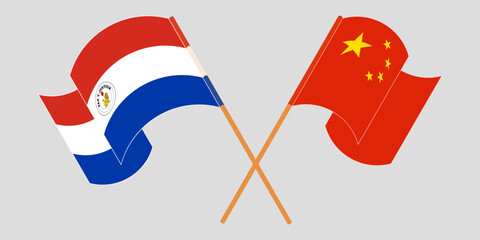 Crossed and waving flags of Republic of Paraguay and China. Vector illustration