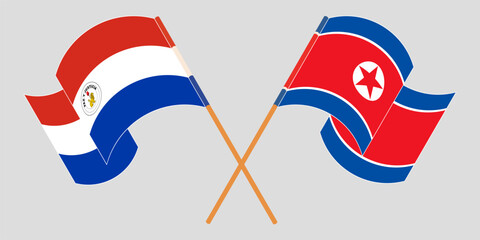 Crossed and waving flags of Republic of Paraguay and North Korea. Vector illustration