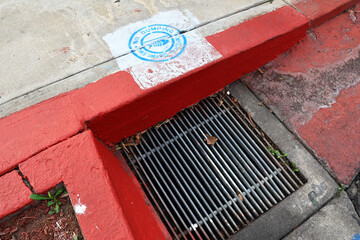 No Dumping &ndash; This Drains to Ocean. Drain Environmental Sign on the sidewalk