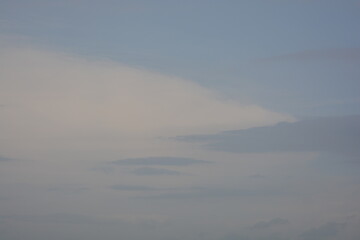 Pastel sky background with soft cloud layers and copy space