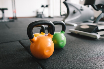 Fototapeta premium Two dumbbells on the gym floor, copy space
