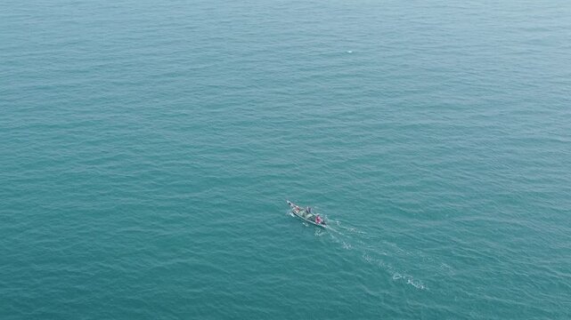 29.12.2025. Puri Orissa India aerial video clip of a lonely boat sailing through the  deep bluish sea water in India
