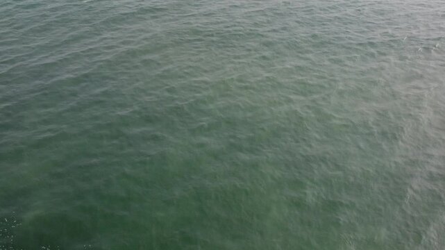 aerial top view drone video clip of scenic wave formation in a sea beach of famous travel destination city Puri in India