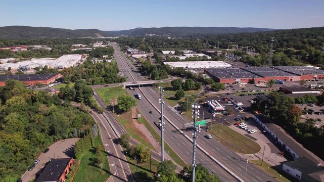 Drone aerial shot of NJ-17 interstate 17 highway and multi-lane road way in New Jersey with car traffic heading towards New York City NYC in American Atlantic East Coast roadway landscape in tri-state