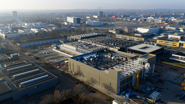 Datacenter Iron Mountain, Netherlands - 24 January 2026: Aerial view of the sprawling data center complex, a modern industrial landscape of structured buildings under a soft winter sky.