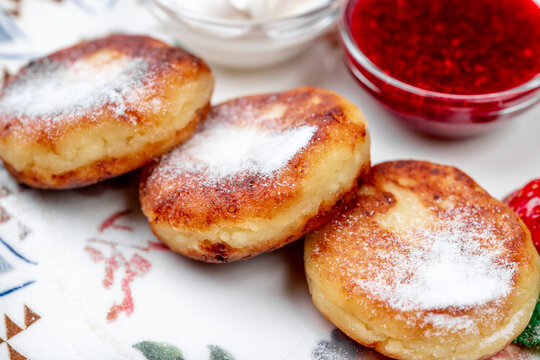 Traditional Russian Syrniki (Cottage Cheese Pancakes) with Powdered Sugar