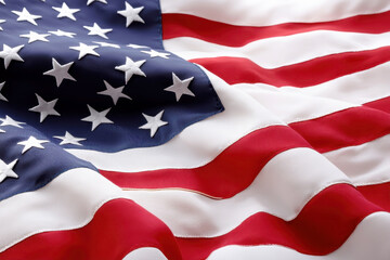 Obraz premium A close-up view of a waving American flag, showcasing its vibrant red and white stripes and the embroidered stars on a deep blue field