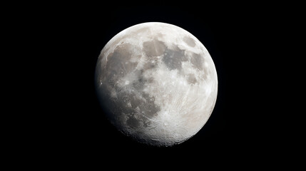 Obraz premium Close-up of the moon's surface with craters and shadows.