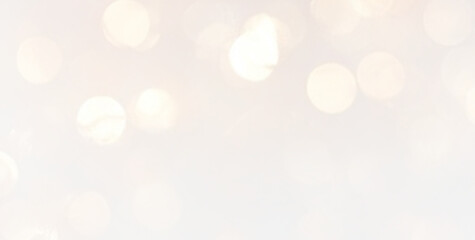 Bright golden bokeh sparkle glow light glitter abstract background.  © Yana