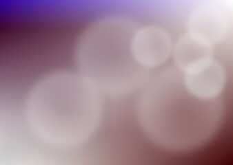 An abstract blue bokeh background with bright glowing circles and shiny magic light effects creates a blurred holiday decoration backdrop for a festive Christmas night design