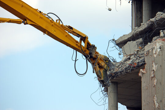 Demolition of the building with demolition excavator