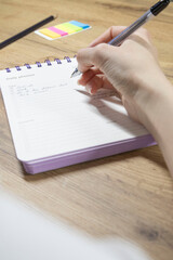 Writing in Daily Planner at Home