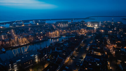 Naklejka premium Aerial from Harlingen at christmas time in Friesland the Netherlands at night