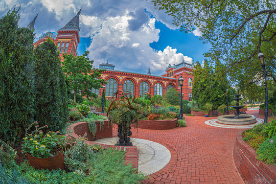 Victorian facade of the Smithsonian Castle, Arts & Industries Building, with beautiful garden in foreground, located on National Mall, Washington DC, USA