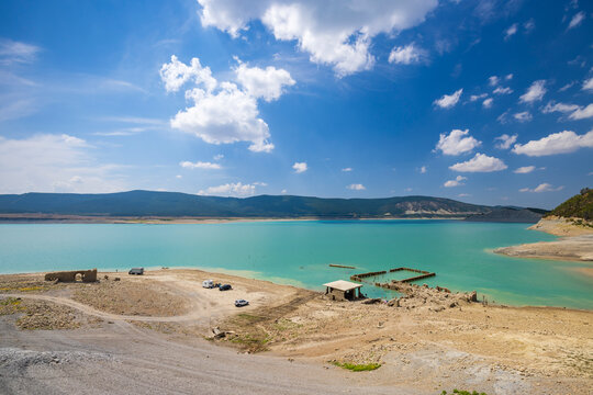 Yesa reservoir showing low water levels exposing structures