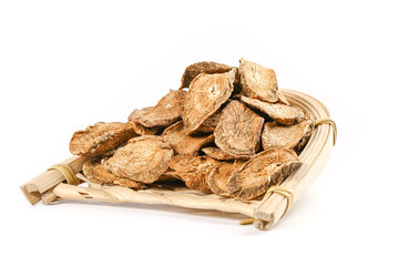 Obraz premium Dried Burdock Root Slices on Bamboo Mat for Herbal Tea