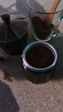 Preparing fresh morning coffee with moka pot