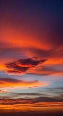 Obraz premium Dramatic twilight sky background featuring a heavy vignette effect that focuses attention on the intense central colors of sunset clouds, template, twilight, beauty