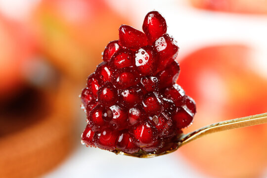 Fresh Pomegranate with Seeds and Water Droplets Close-Up