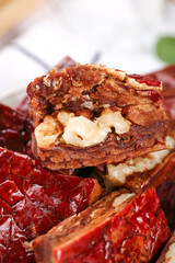 Obraz premium Fresh Xinjiang Date and Walnut Pie Slice with Nuts