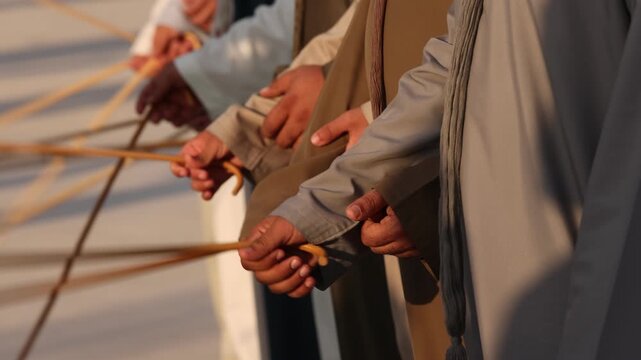 Traditional Emirati Al Ayala male dance, cultural UAE heritage, hands in frame