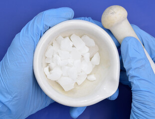 Aluminium sulfate on blue background.