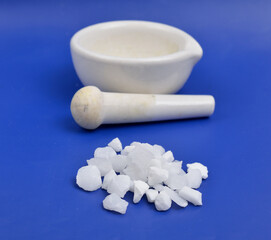 Aluminium sulfate on blue background.