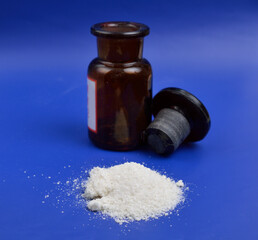 Sodium diethyldithiocarbamate powder on the light gray background