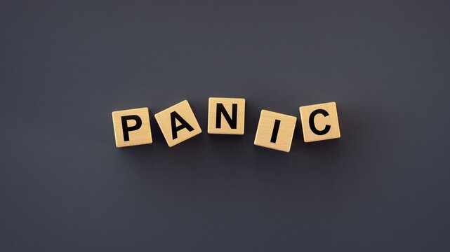 Wooden blocks spelling the word Panic on a dark background, symbolizing sudden market turmoil, selling, financial uncertainty, or stock market crashes. 3D render animation