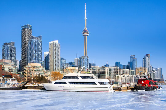 Toronto winter waterfront skyline with frozen bay at harbor in foreground 