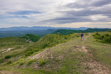 Fototapeta premium Hiking trail near the town of Apellaniz in the Basque Country reaching the top of mountains of San Cristobal and San Justi (Spain)