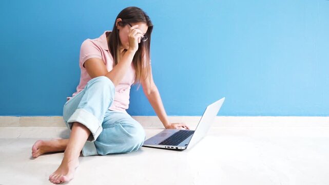 person working with a laptop, woman typing on notebook