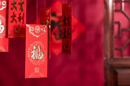 Chinese New Year Red Packet Decorations with Gold Calligraphy Text