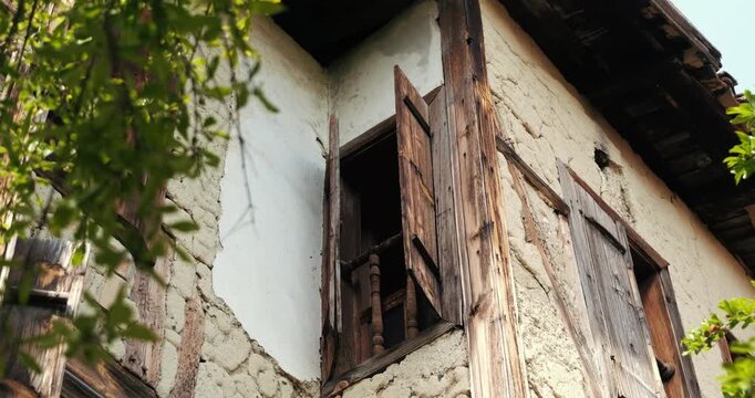 Traditional Ottoman architecture in Safranbolu, Turkey; detail of an old wooden window on an adobe wall.
