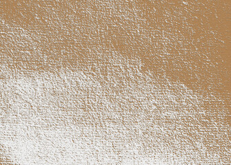 Rough brown plaster wall creating an abstract texture