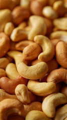 Fototapeta premium Macro shot of a pile of raw cashew nuts highlighting texture and natural color.