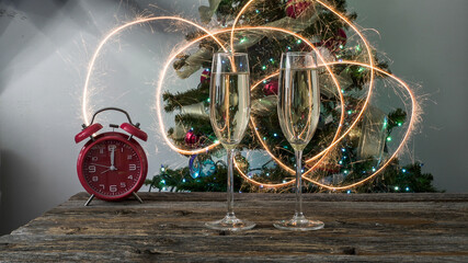 Celebrating new year with champagne flutes and sparkling lights