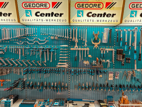 Pamplona, ​​Spain - January 31, 2026. Hardware store, a very well-organized tool panel, typical of a mechanical or industrial workshop. It's a blue pegboard wall where wrenches, sockets, and hand tool
