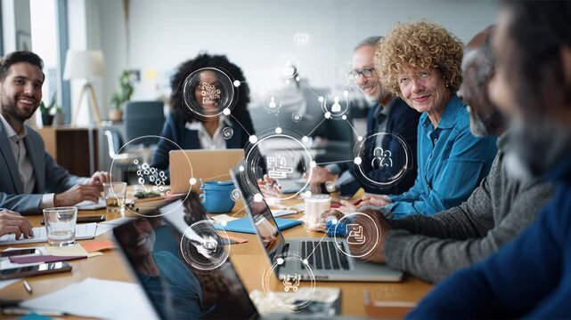 creative office team collaborating around table with product manager, UX designer, developer and marketer reviewing laptops, charts and notes, sharing analytics