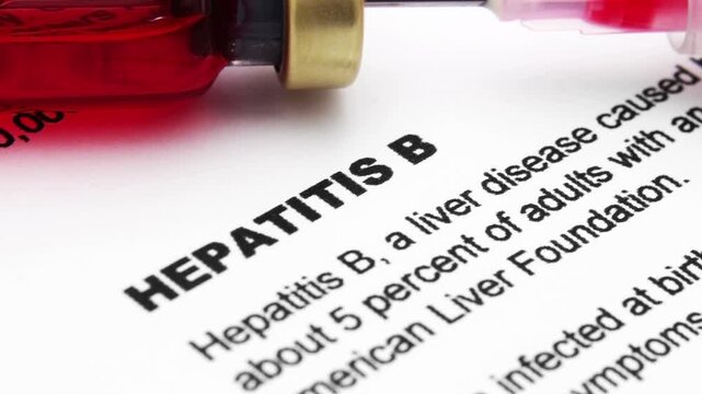 Medical Syringe With Red Liquid Vial Over Hepatitis B Document For Health Care