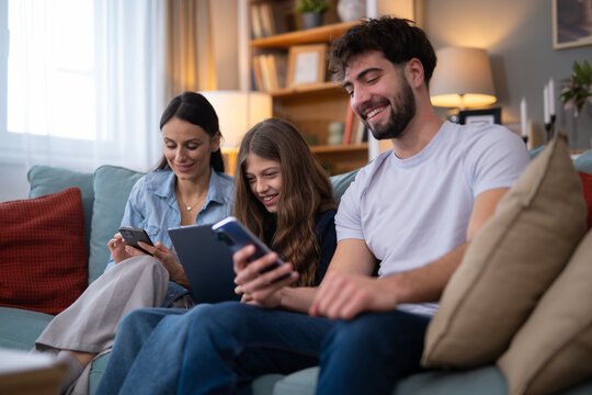 Family using multiple digital devices at home
