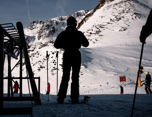silhouette of a skier skiing in the mountains